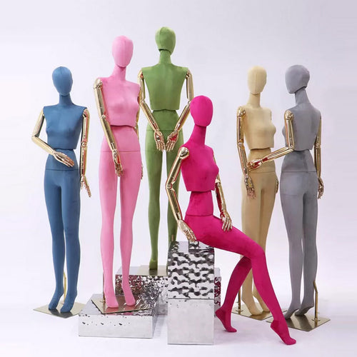 Luxury female full body mannequin in green velvet with gold hands for boutique window display