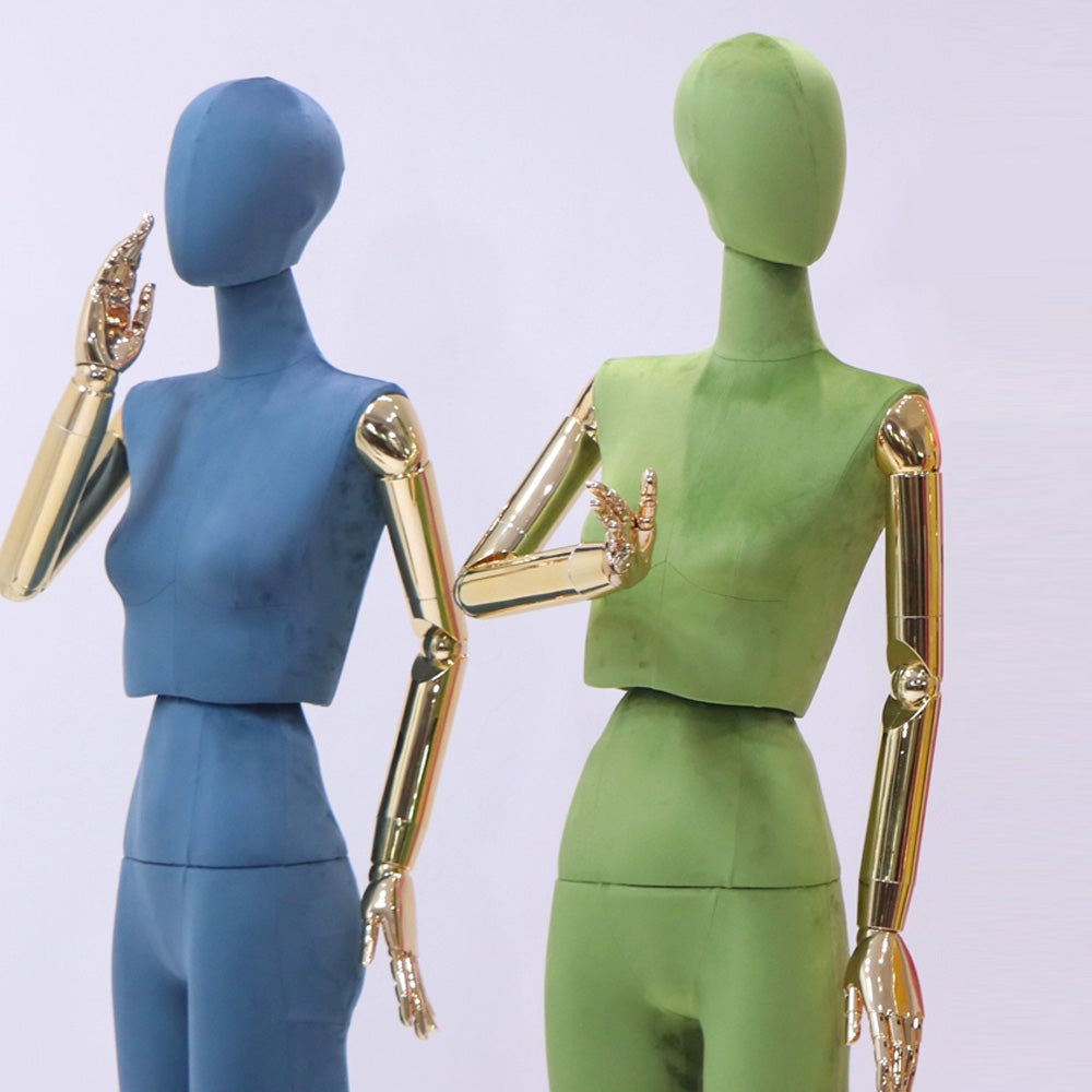 Close-up of premium colorful velvet fabric and gold plating hands on dress form