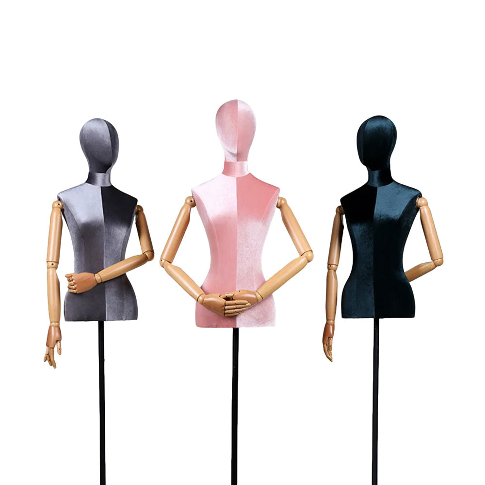 Two-tone velvet female mannequin torso with movable wooden arms and black triangle base for luxury fashion display.