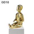 eated gold child mannequin for kidswear showroom display