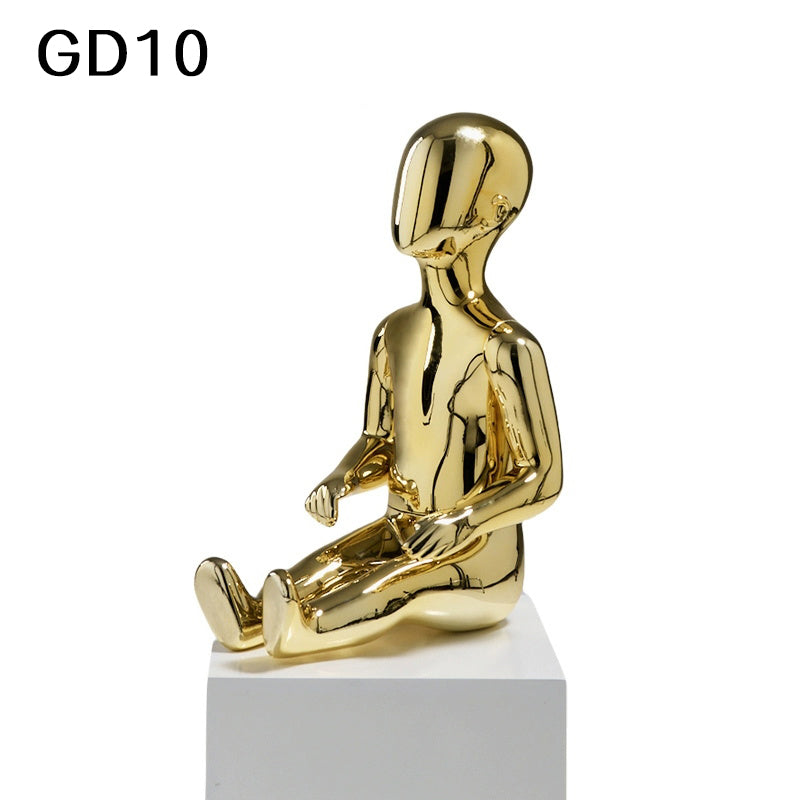 eated gold child mannequin for kidswear showroom display