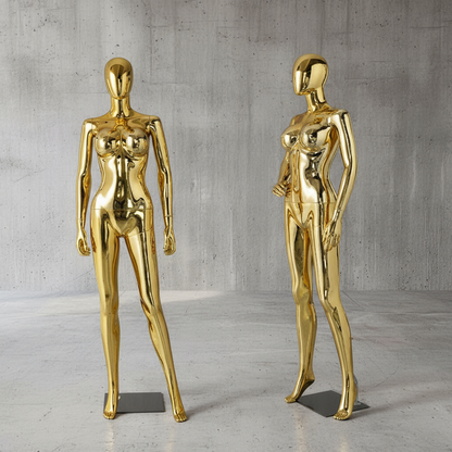 Gold Mannequins on Concrete Background
