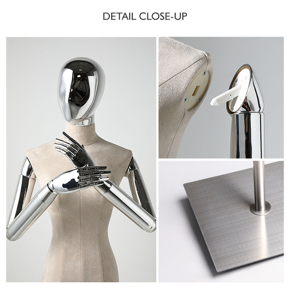 Close-up of a beige velvet female mannequin torso with mirrored head, silver articulated arms and square metal base