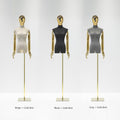 Beige, black and gray velvet female mannequin torsos with mirrored heads, silver articulated arms and adjustable stands