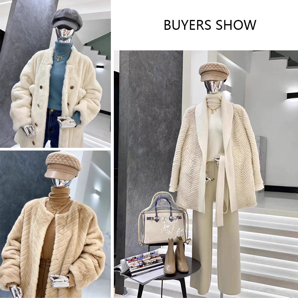 Velvet female mannequin torso displaying coats, knitwear, hats and jewelry in a boutique clothing display